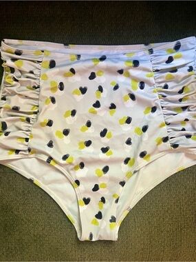 Kortni Jeane High-Waist Bikini Bottoms in white with Yellow & Black Spots